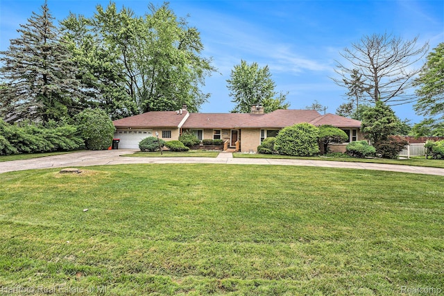 19100 Coral Gables St, Southfield, MI 48076 - single story home with concrete driveway, a garage, a front lawn, and a chimney