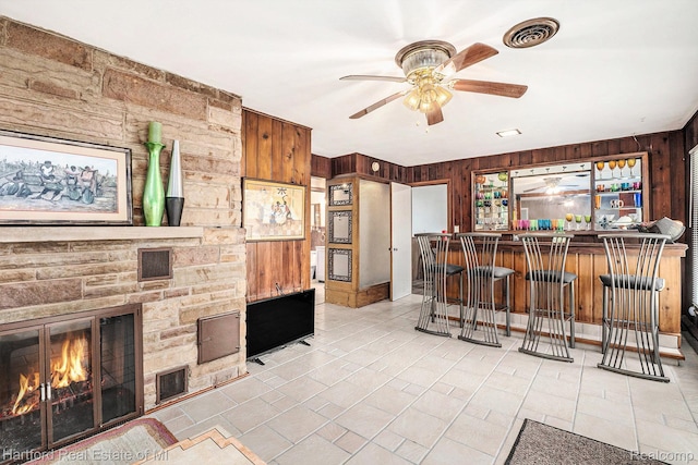 19100 Coral Gables St, Southfield, MI 48076 - kitchen with wood walls, a fireplace, and ceiling fan