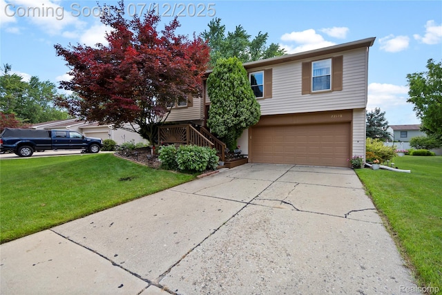 23528 Londonderry, Novi, MI 48375 - view of front of property with an attached garage, a front yard, and driveway