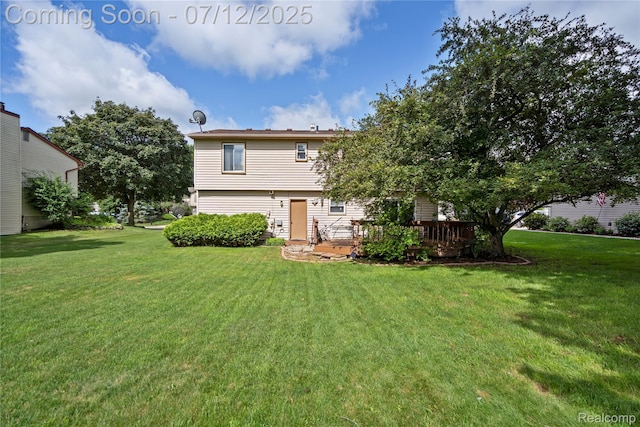 23528 Londonderry, Novi, MI 48375 - rear view of house with a lawn and a deck