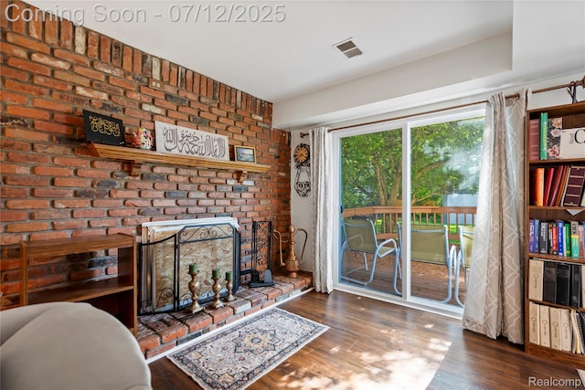 23528 Londonderry, Novi, MI 48375 - living area featuring wood finished floors and a fireplace