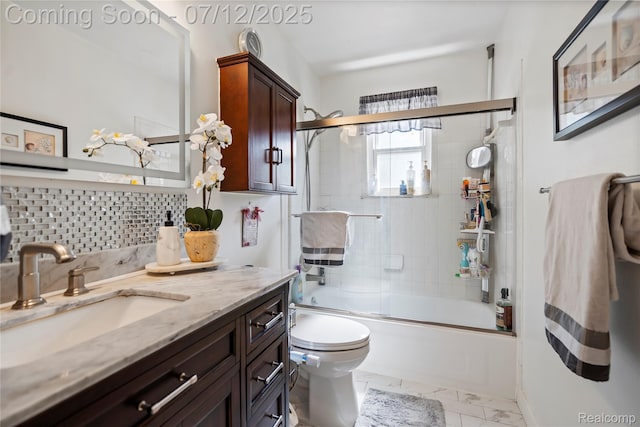 23528 Londonderry, Novi, MI 48375 - bathroom featuring vanity, marble finish flooring, bath / shower combo with glass door, and backsplash