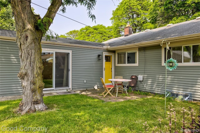 4217 Crooks Rd, Royal Oak, MI 48073 - back of house with a lawn, a patio, and a chimney