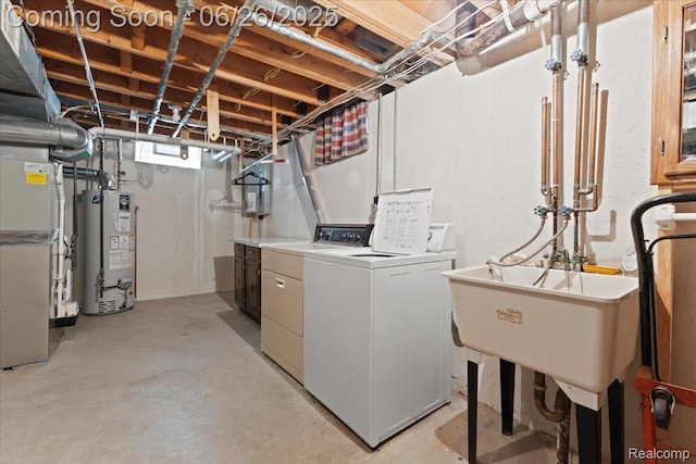 41615 Westmeath Cir, Clinton Township, MI 48038 - washroom with gas water heater and washing machine and dryer