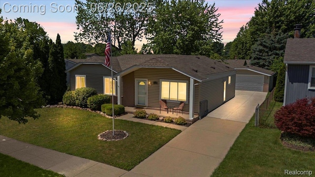41615 Westmeath Cir, Clinton Township, MI 48038 - single story home with an outbuilding, a lawn, and a detached garage