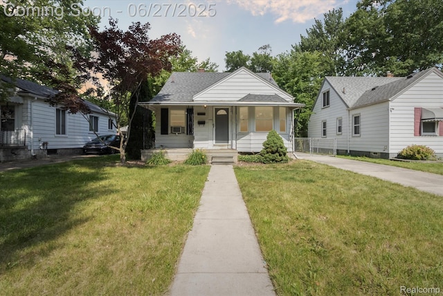 15848 Woodworth, Plymouth, MI 48239 - bungalow with covered porch, a front lawn, driveway, and cooling unit