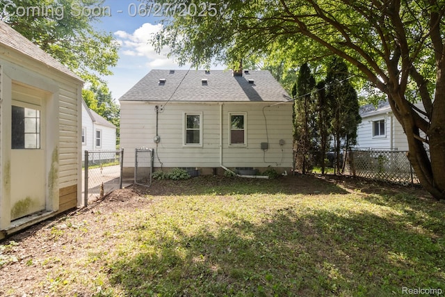 15848 Woodworth, Plymouth, MI 48239 - back of house with roof with shingles and a gate