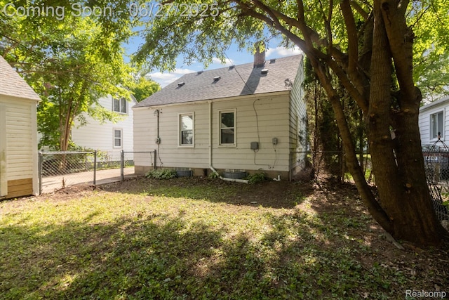 15848 Woodworth, Plymouth, MI 48239 - back of property featuring a chimney and a shingled roof