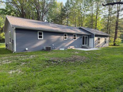 817 Sandow Rd, Midland, MI 48640 - back of house with a yard and a patio