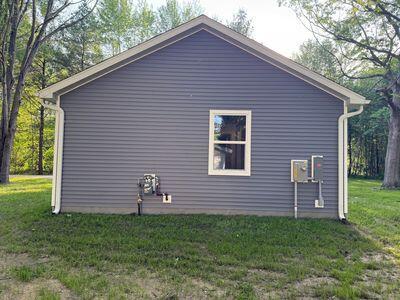 817 Sandow Rd, Midland, MI 48640 - view of side of property featuring a yard