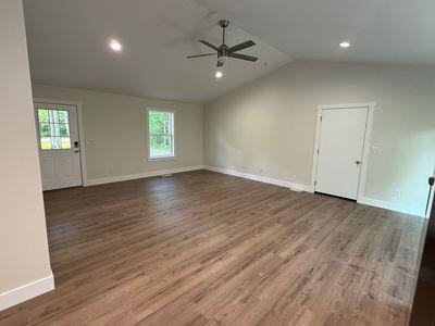 817 Sandow Rd, Midland, MI 48640 - spare room with a ceiling fan, vaulted ceiling, healthy amount of natural light, wood finished floors, and recessed lighting