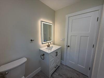 817 Sandow Rd, Midland, MI 48640 - bathroom featuring vanity and toilet
