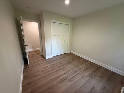 817 Sandow Rd, Midland, MI 48640 - unfurnished bedroom featuring wood finished floors, a closet, and recessed lighting