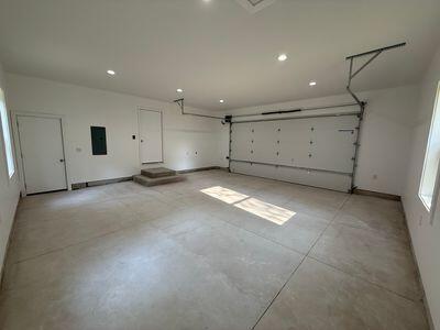 817 Sandow Rd, Midland, MI 48640 - garage featuring recessed lighting and electric panel