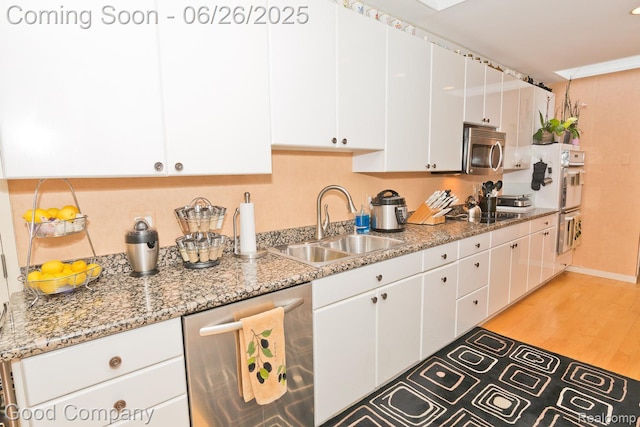 3788 Crestlake Dr, Bloomfield Hills, MI 48304 - kitchen with stainless steel appliances, white cabinetry, light wood-type flooring, and light stone counters