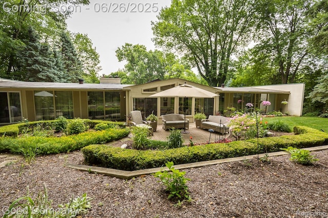 3788 Crestlake Dr, Bloomfield Hills, MI 48304 - rear view of house featuring an outdoor living space and a chimney
