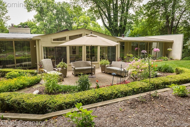3788 Crestlake Dr, Bloomfield Hills, MI 48304 - rear view of property featuring outdoor lounge area, a chimney, and a sunroom
