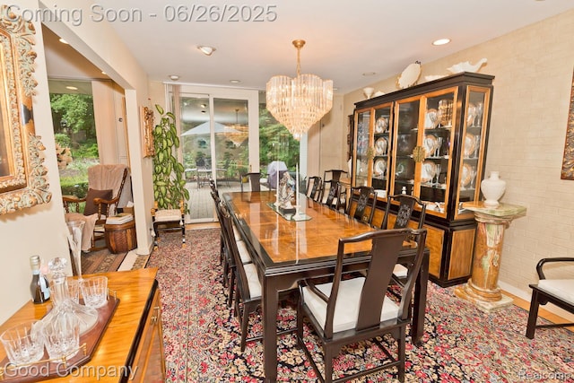 3788 Crestlake Dr, Bloomfield Hills, MI 48304 - dining room featuring a chandelier and brick wall