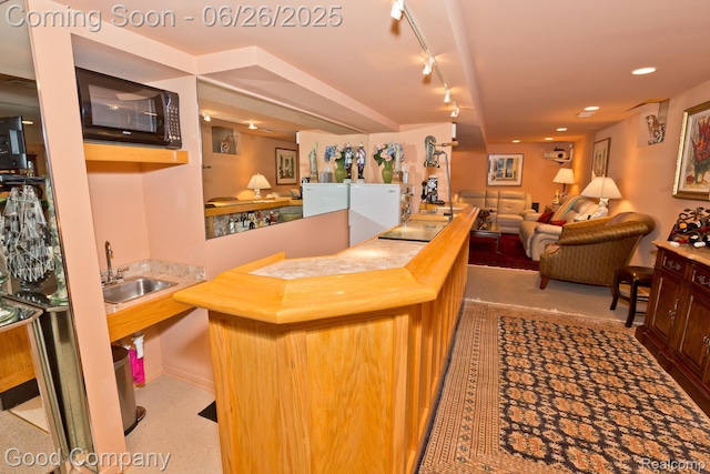 3788 Crestlake Dr, Bloomfield Hills, MI 48304 - indoor wet bar with black microwave and rail lighting