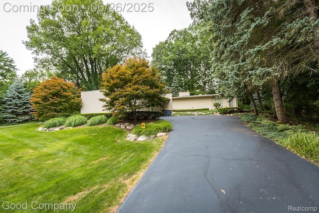 3788 Crestlake Dr, Bloomfield Hills, MI 48304 - view of front of property featuring asphalt driveway, a front lawn, and stucco siding
