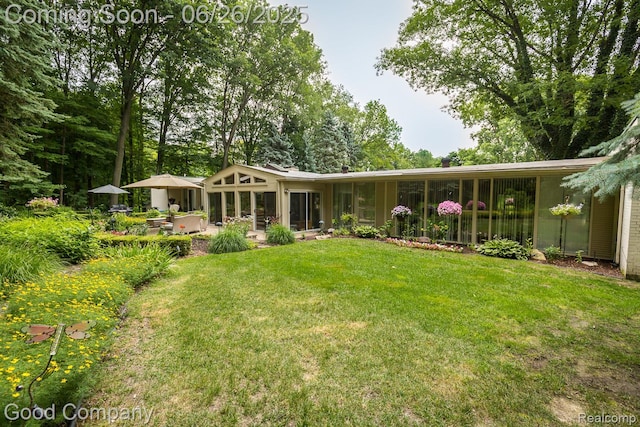 3788 Crestlake Dr, Bloomfield Hills, MI 48304 - back of house featuring a lawn and a patio
