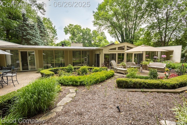 3788 Crestlake Dr, Bloomfield Hills, MI 48304 - rear view of property with an outdoor hangout area, a patio, and a chimney