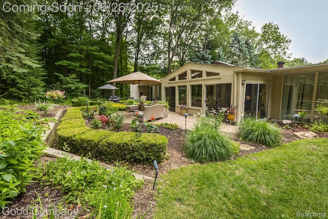 3788 Crestlake Dr, Bloomfield Hills, MI 48304 - rear view of house featuring a patio, a sunroom, and a chimney