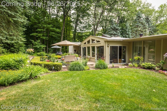3788 Crestlake Dr, Bloomfield Hills, MI 48304 - view of grassy yard with a sunroom and a patio