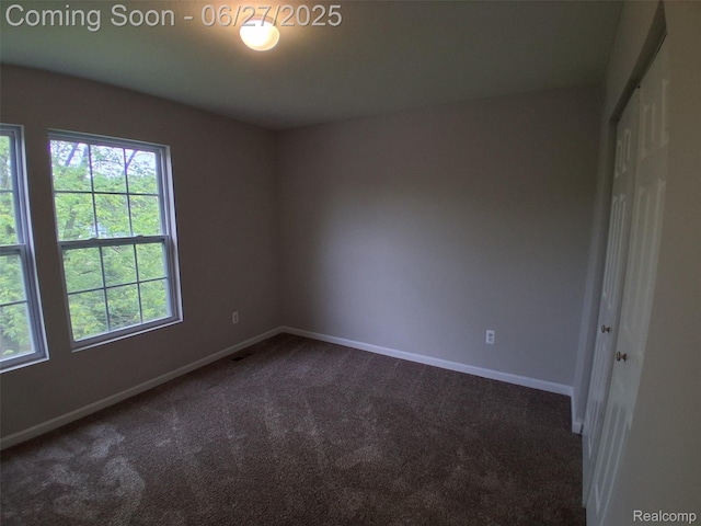 155 Cascade Ln, Waterford, MI 48327 - empty room featuring dark carpet and baseboards