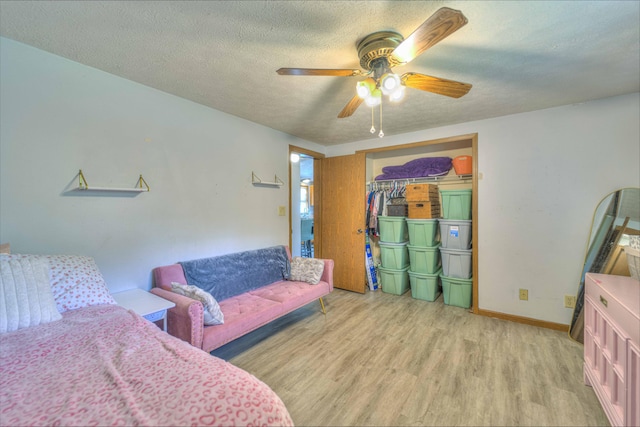 123 Carlysle Dr, Brooklyn, MI 49230 - bedroom featuring wood finished floors, a textured ceiling, ceiling fan, and a closet