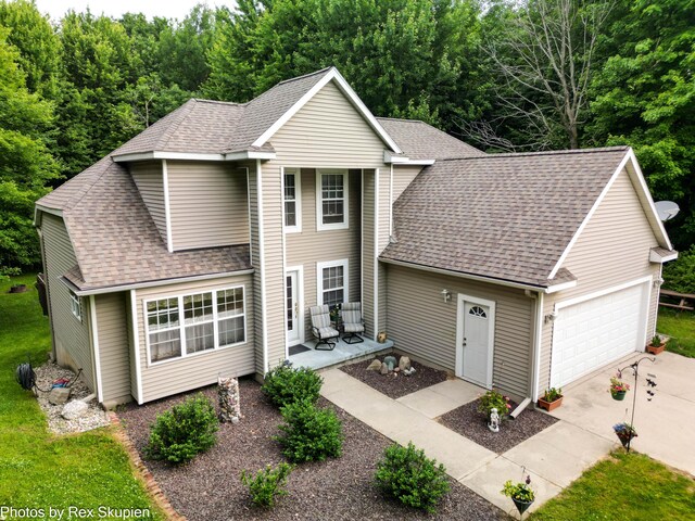 17474 Connor Cir, Bailey, MI 49303 - traditional-style house with a shingled roof and an attached garage
