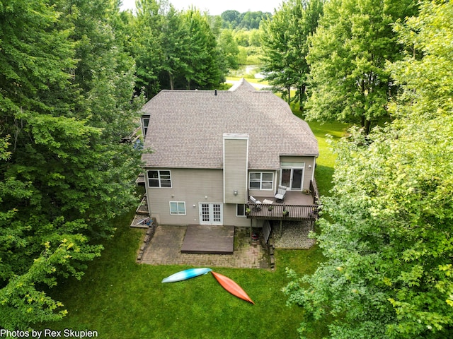 17474 Connor Cir, Bailey, MI 49303 - back of property featuring a patio, roof with shingles, a deck, french doors, and a yard