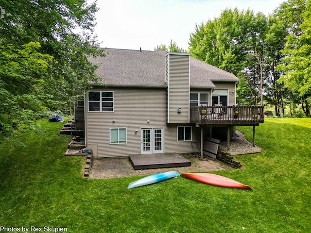17474 Connor Cir, Bailey, MI 49303 - rear view of property featuring a wooden deck, a patio, french doors, a yard, and a chimney