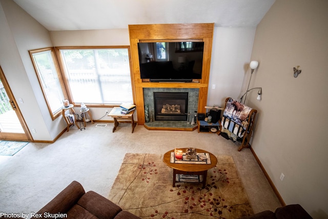 17474 Connor Cir, Bailey, MI 49303 - living room with carpet, healthy amount of natural light, and a tiled fireplace