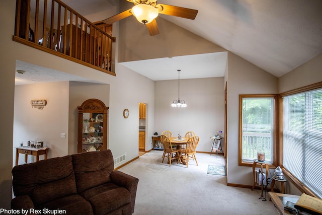 17474 Connor Cir, Bailey, MI 49303 - living area featuring high vaulted ceiling, light colored carpet, a chandelier, and ceiling fan