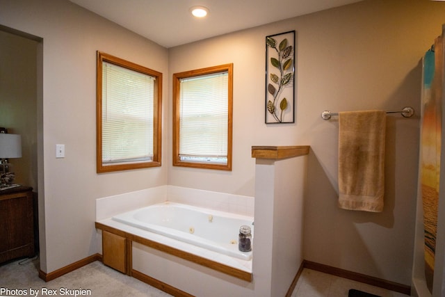 17474 Connor Cir, Bailey, MI 49303 - bathroom with a jetted tub and baseboards