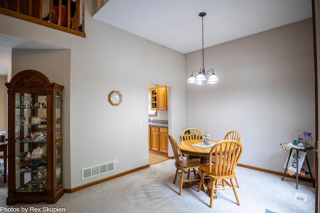 17474 Connor Cir, Bailey, MI 49303 - dining room with a chandelier and light carpet
