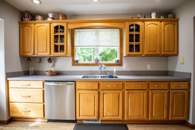17474 Connor Cir, Bailey, MI 49303 - kitchen with stainless steel dishwasher, glass insert cabinets, recessed lighting, light wood-style floors, and brown cabinets