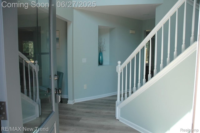 785 Pathway Dr, Howell, MI 48843 - foyer featuring stairs and wood finished floors