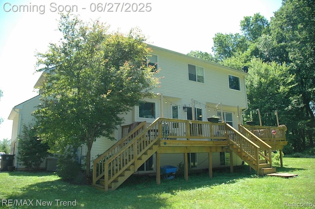 785 Pathway Dr, Howell, MI 48843 - back of house with stairs, a yard, and a deck