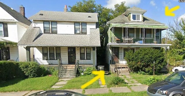6325 Scotten St, Detroit, MI 48210 - view of front facade featuring covered porch and a balcony