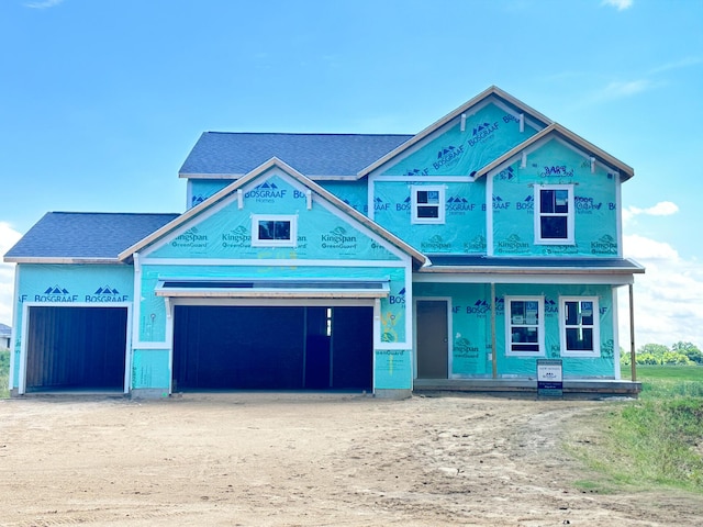 548 Lincoln Lawns Dr NW, Walker, MI 49534 - property in mid-construction with driveway, an attached garage, a shingled roof, and a porch