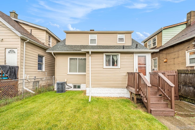 701 Cleophus Pkwy, Lincoln Park, MI 48146 - rear view of house with a fenced backyard and a shingled roof