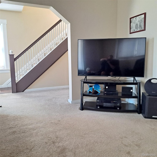 701 Cleophus Pkwy, Lincoln Park, MI 48146 - carpeted living room featuring baseboards and stairway