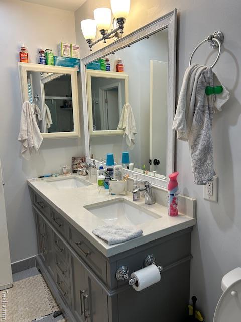 20796 Gill Rd, Farmington Hills, MI 48335 - bathroom with double vanity and a chandelier