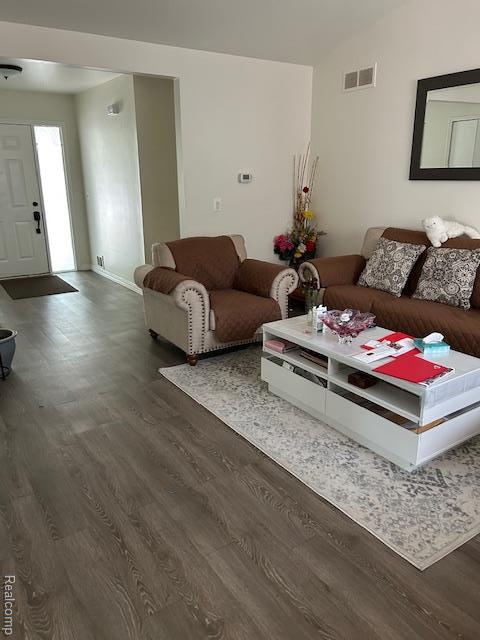 20796 Gill Rd, Farmington Hills, MI 48335 - living area with wood finished floors and vaulted ceiling