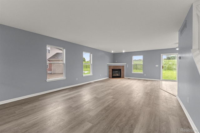 10913 Edlie Cir, Dearborn Heights, MI 48214 - unfurnished living room with wood finished floors and a fireplace