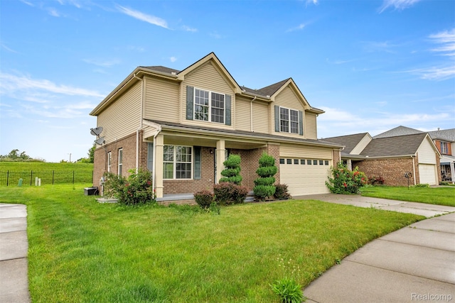 10913 Edlie Cir, Dearborn Heights, MI 48214 - traditional-style house featuring brick siding, a garage, driveway, and covered porch