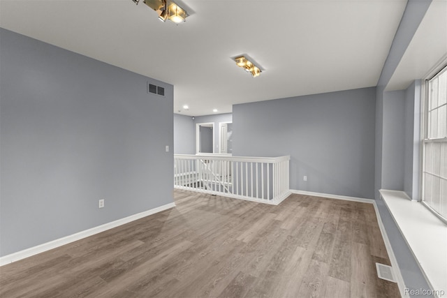 10913 Edlie Cir, Dearborn Heights, MI 48214 - spare room featuring wood finished floors and recessed lighting
