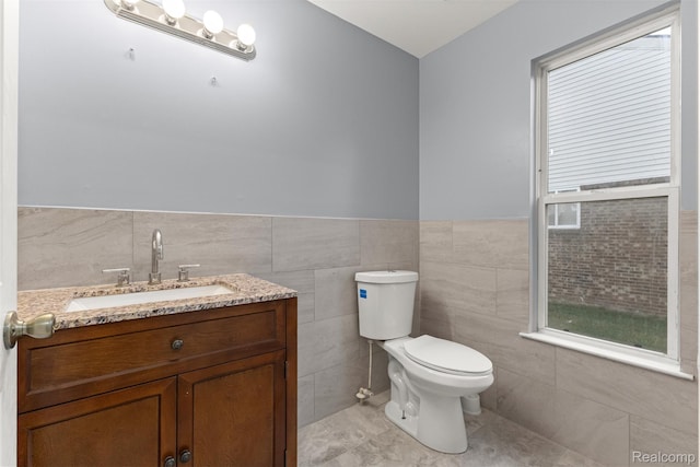 10913 Edlie Cir, Dearborn Heights, MI 48214 - bathroom with tile walls, vanity, a wainscoted wall, and tile patterned floors